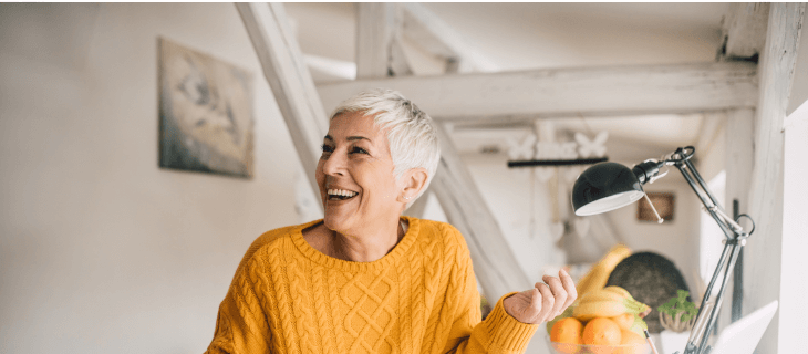 Woman orange jumper conversing Woman orange jumper conversing